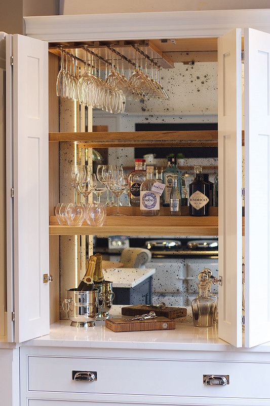 a cabinet filled with lots of wine glasses