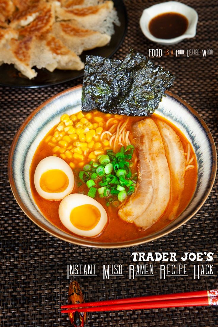 a bowl of ramen with eggs, meat and vegetables