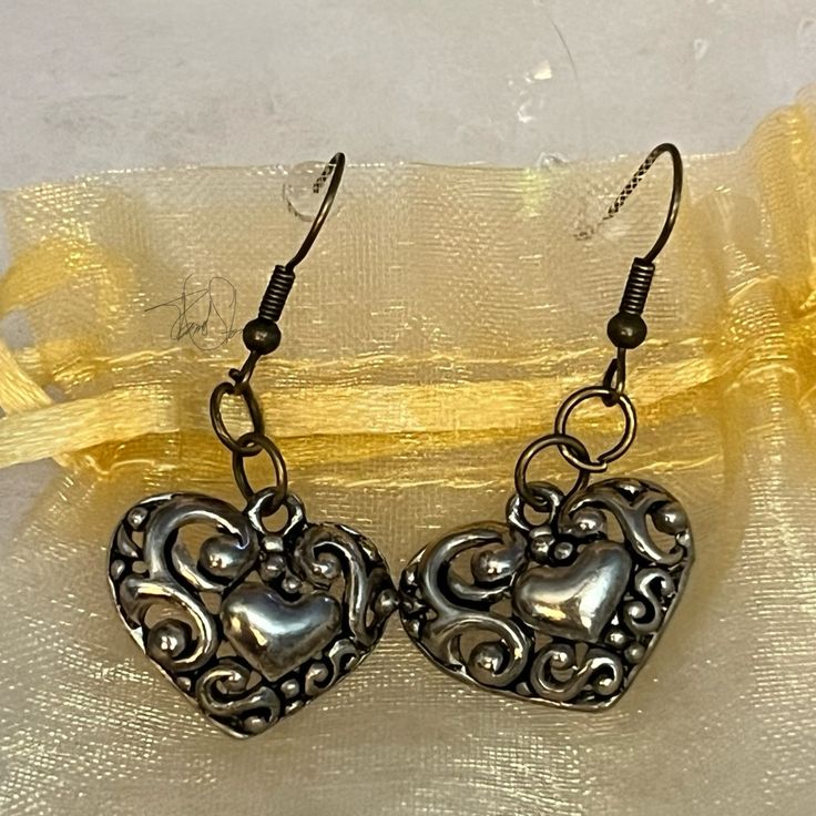 Swirly Heart Dangler Earrings. Stylish, Lightweight And Antique Looking. The Holidays Are Here! Great Little Something For The Open-Hearted. Nice Gift! Please Share If You’re Not Interested. Thanks. Silver Heart Beads Earrings For Anniversary, Metal Heart Pendant Earrings For Anniversary, Metal Heart Beads Earrings For Gifts, Metal Heart Beaded Earrings For Gifts, Heart Beads Metal Earrings For Gift, Adjustable Silver Heart Earrings, Gift Metal Heart Earrings With Heart Beads, Metal Heart Bead Earrings As Gift, Silver Heart Drop Earrings For Valentine's Day