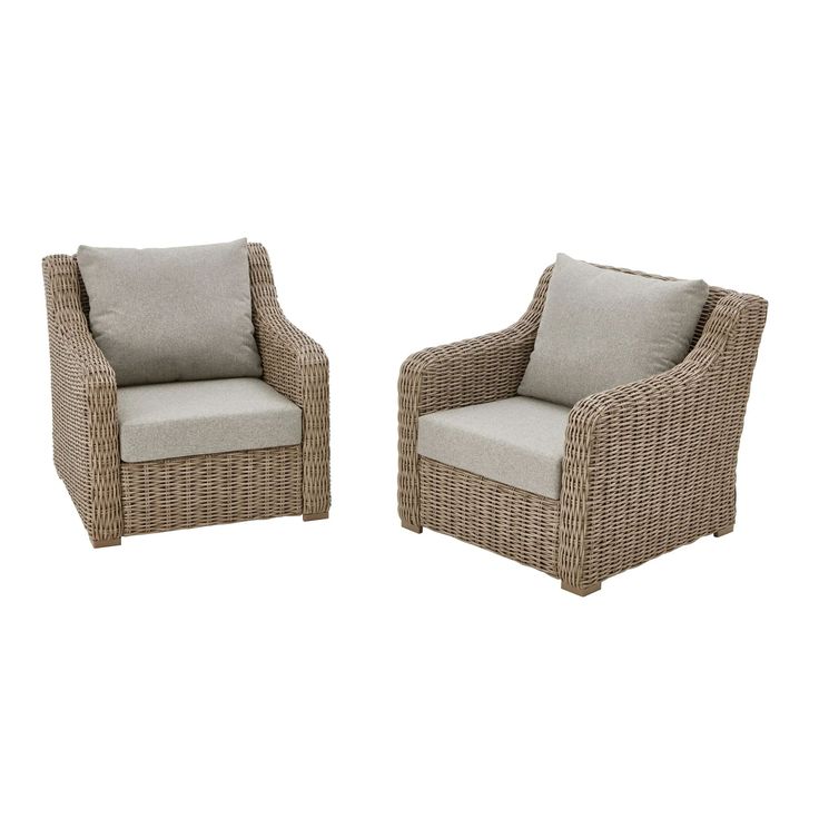 two wicker chairs sitting next to each other