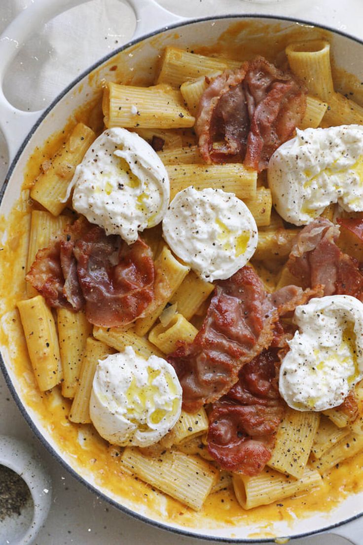 pasta with meat, cheese and sauce in a pan