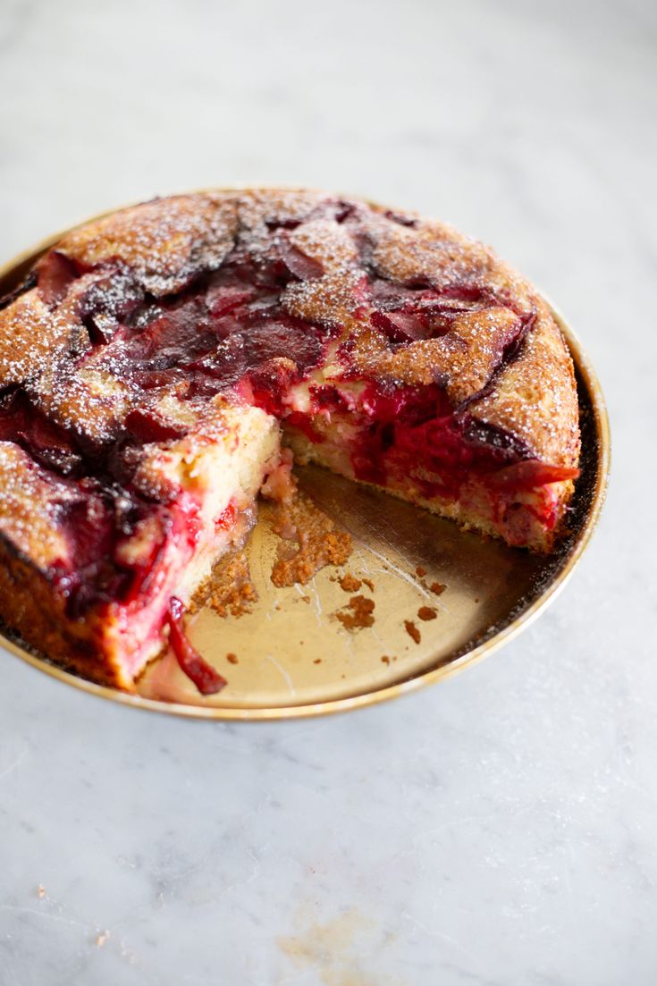 a cake that has been cut into pieces and is sitting on a plate with one slice missing