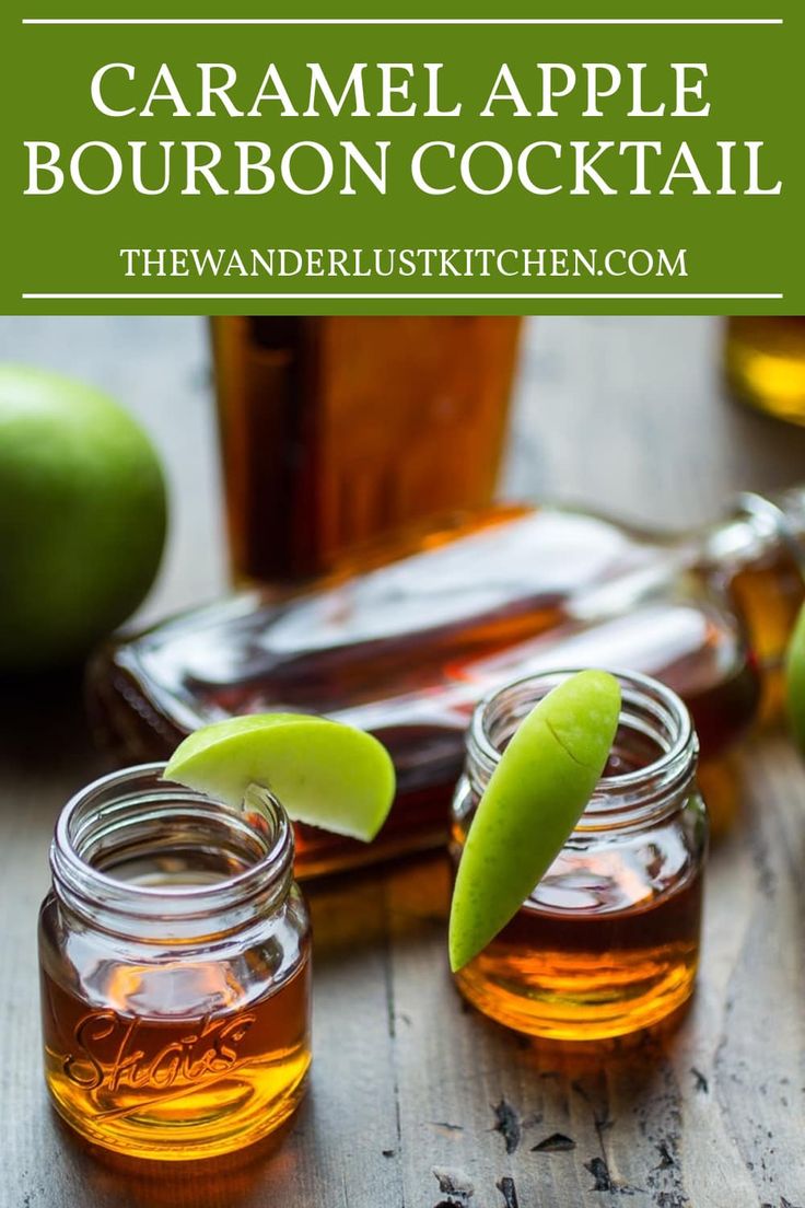 caramel apple bourbon cocktail with limes on the side and two jars in front