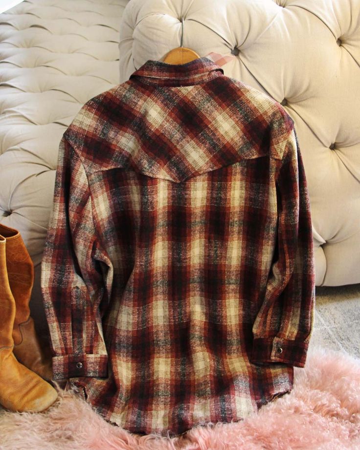 Cozy & so cute! Inspired by a men's vintage button-up shirt but updated for a feminine fit. Sweet snap button front, cozy plaid & darling pockets. Oversized fit. We added a bit of soft wool with the cotton blend so it is perfect for chilly weather. Color: Cream, taupe & burgundy Soft cotton, wool & poly blend Hand wash cold Small Medium Large Bust 45 47 49 Waist 45 47 50 Hips 46 48 51 Length 32 32 33 Bust, waist, and hip measurements are a total circumference. Length is measured from the top of Sweet Snap, Chilly Weather, Vintage Button, Cotton Wool, Soft Wool, Large Bust, Snap Button, Oversized Fits, Vintage Men