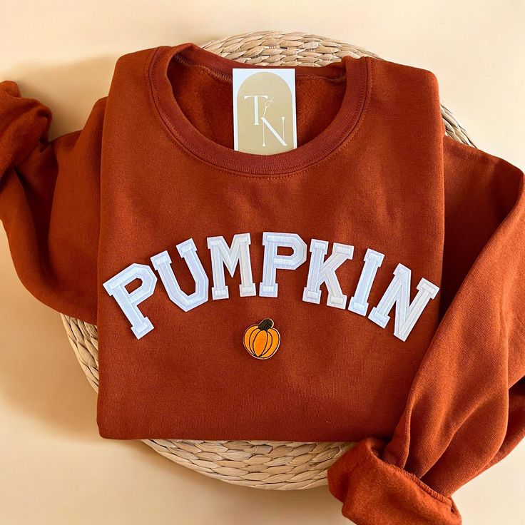 Cozy up with our Pumpkin Crewneck Sweatshirt this fall season! It is also a great gift to your loved ones who loves pumpkin or fall season! - Sweatshirt is super soft and comfy! ♡ - Sweatshirt composition: 50% cotton, 50% polyester - All our sweatshirts run a unisex fit. They are naturally oversized, so we normally recommend your true size. But if you like a more baggy look, we recommend sizing up. - These letters are iron-on patched and is heat pressed, not embroidered. But rest assured they've Pumpkin Sweater Outfits, Fall Sweaters Aesthetic, Fall Sweatshirt Ideas, Pumpkin Crewneck, Applique Clothes, Season Outfits, Fall Crewneck, Wifey Sweatshirt, Thanksgiving Sweater