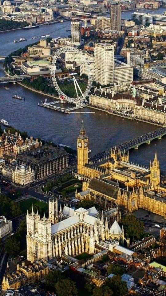 an aerial view of london with big ben and the river thames in the foreground