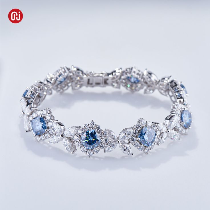 Brand:GIGAJEWE® Product Name:Gigajewe 35.52CT Blue and White Color Moissanite  Bracelets 9K/14K/18K White Gold 136 pieces Cushion and Marquise cut shape Wedding Bracelet Main Stone Material:Moissainte Stone  Shape:Cushion and Marquise cut and Round Cut Color:blue color and White D Color  Stone Weight:cushion:8mm 20ct total,marquise 3.5*7mm and 3*6mm total 9.71ct,round 2.5mm total 5.76ct Total Carat:35.52ct stone quantity:136pieces weight:27.68g Customization:Can select different kinds of gemstone for customization Light Blue Diamond Wedding Jewelry, Blue Fine Jewelry Tennis Bracelet For Wedding, Luxury Blue Wedding Bracelets, Luxury Blue Bracelets For Wedding, Blue Diamond Bracelet For Wedding, Blue Cubic Zirconia Wedding Bracelet, Blue Tennis Bracelet For Wedding, Blue Diamond Wedding Bracelet, Cubic Zirconia Crystal Bracelet For Wedding