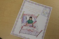 a card with a drawing of a person sitting on a bed