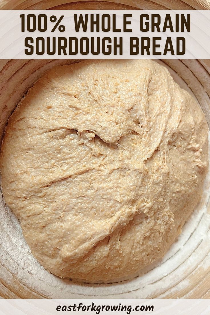 a loaf of bread sitting on top of a white plate with the words, 100 % whole grain sourdough bread