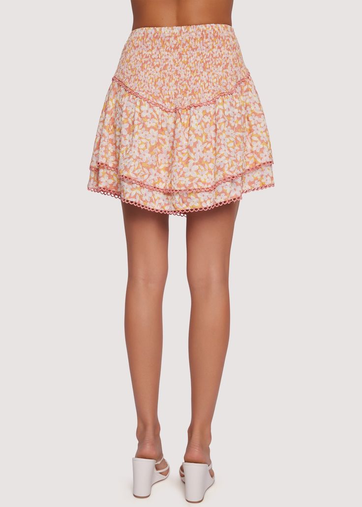 The Coastal Daisies Mini Skirt is designed for a flattering fit and comfortable all-day wear. This mini skirt features a smocked waist with a high-rise fit, a chic asymmetric hem, and a subtle loop trim. It’s perfect for wearing both on special occasions and day-to-day. Complete the look with the matching crop top! WSWS06175-2 Imported 100% Rayon Model is 5 ft 9 inches; Bust: 32", Waist: 23.5", Hips: 35" and wearing a size Small Runs true to size Hand wash or wash with gentle cycle with cold wat White Bottoms With Gathered Waist For Spring, White Summer Skirt With Gathered Waist, White Gathered Waist Summer Skirt, White Gathered Waist Skirt For Summer, Feminine Summer Bottoms With Smocked Bodice, Feminine Bottoms With Smocked Bodice For Summer, Spring White Bottoms With Smocked Back, White Skirt With Smocked Bodice For Spring, White Skirt With Smocked Back For Spring