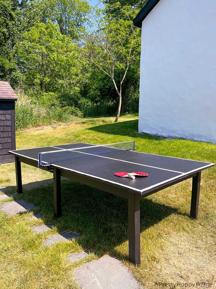 a ping pong table in front of a house