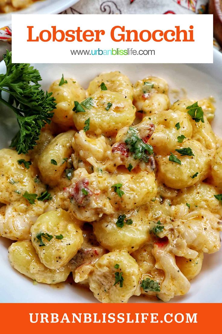 two plates filled with pasta and garnished with parsley on the side text reads lobster gnocchini