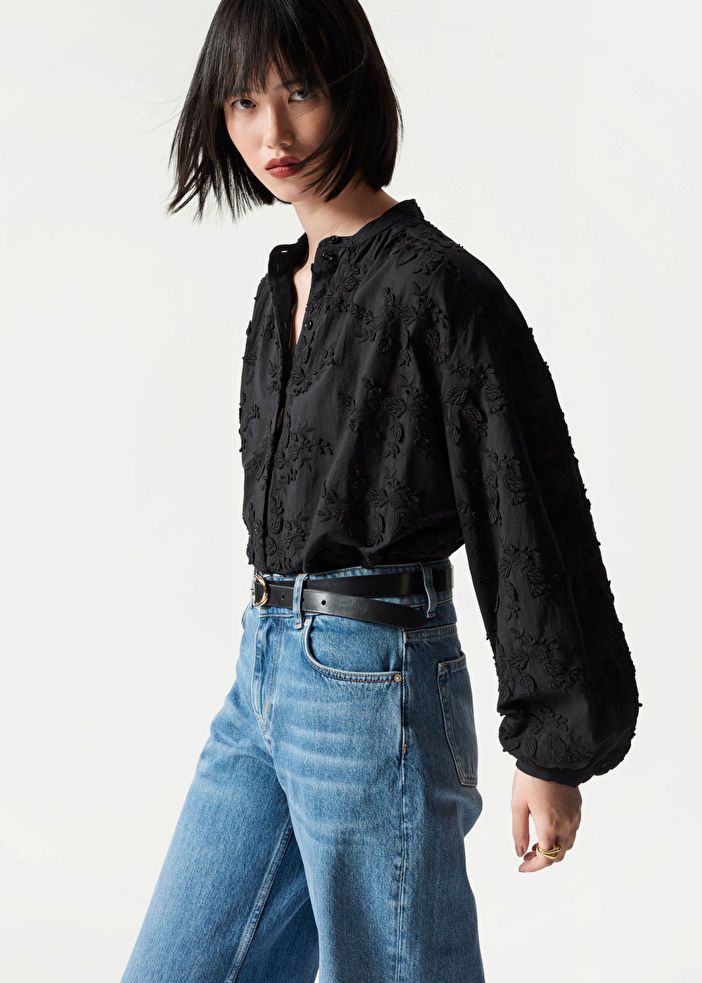 Voluminous Floral-Appliqué Blouse - Black Flower Embroidery - Blouses - & Other Stories US Cotton Blouse With Floral Embroidery For Work, Fall Cotton Blouse With Padding, Cotton Fall Blouse With Padding, Casual Fall Cotton Blouse With Padding, Cotton Padded Blouse For Fall, Chic Floral Embroidered Relaxed Fit Blouse, Chic Floral Embroidered Blouse With Relaxed Fit, Chic Relaxed Fit Blouse With Floral Embroidery, Band Collar Blouse