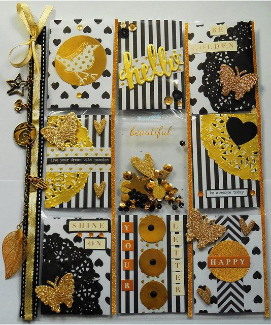 a scrapbook with gold and black decorations