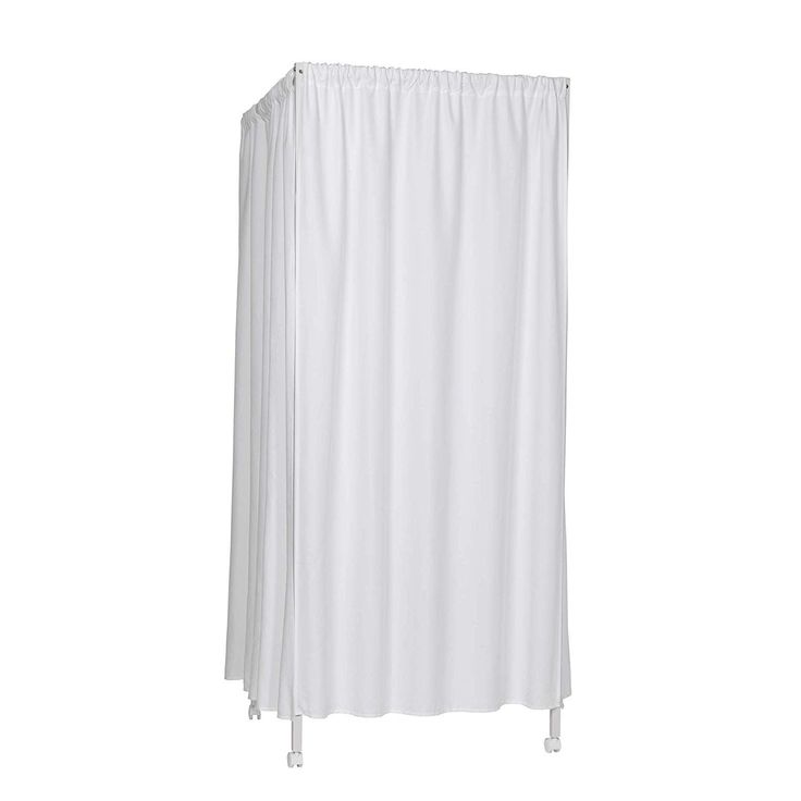 a white shower curtain hanging on the side of a wall