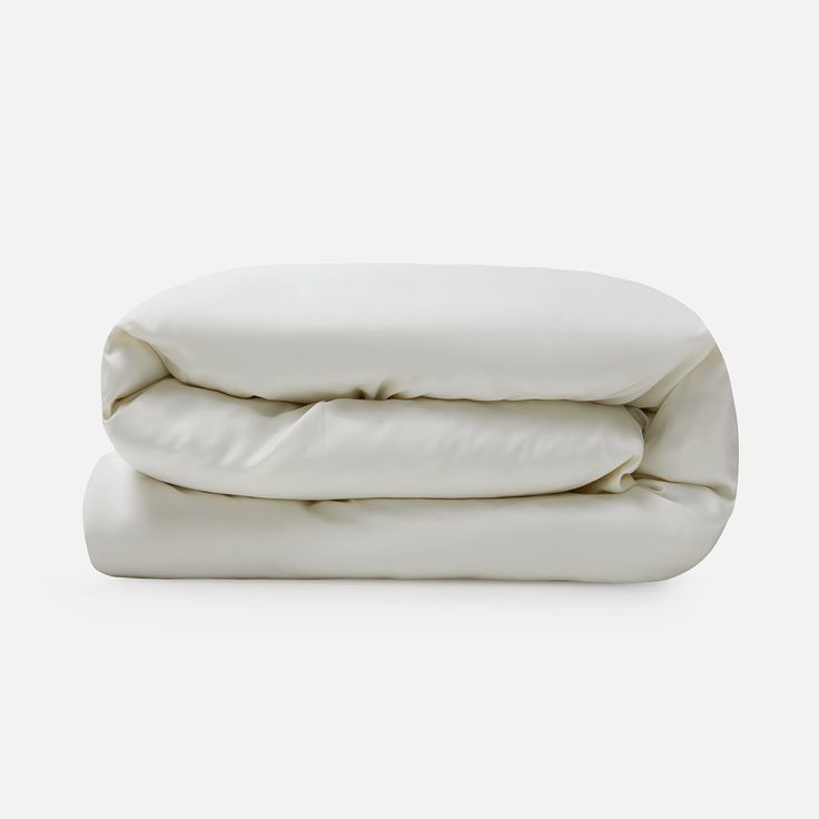 two white pillows stacked on top of each other