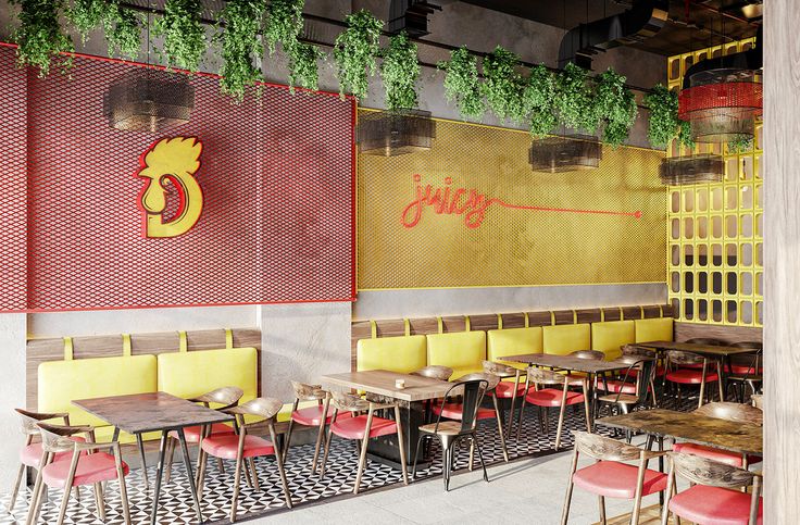 the interior of a restaurant with yellow and red chairs