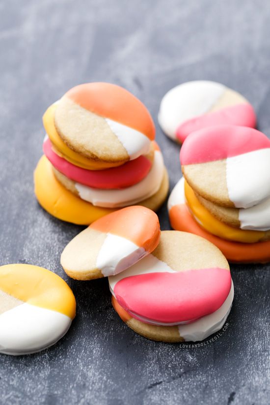 some cookies with different colored frosting on them