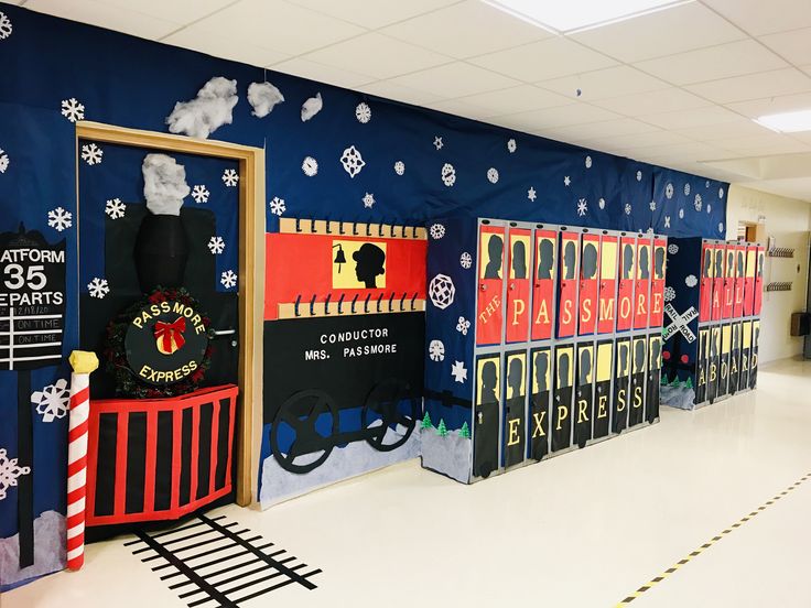 a hallway decorated with train themed doors and snowflakes