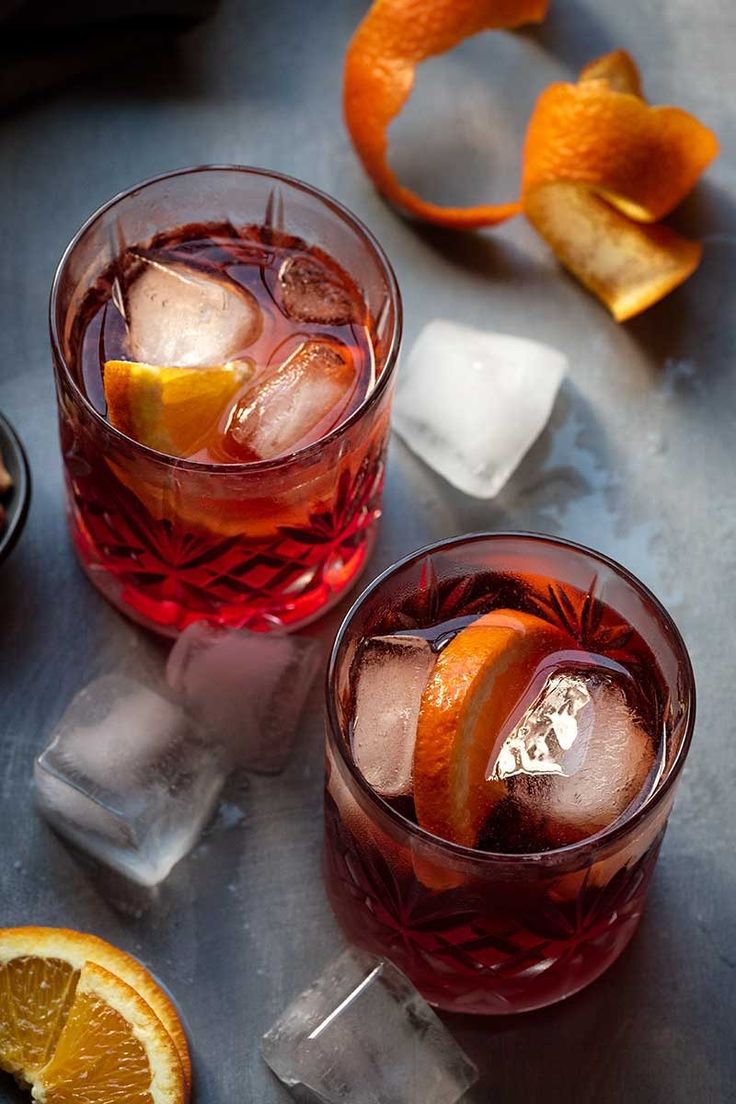 two glasses filled with ice and orange slices