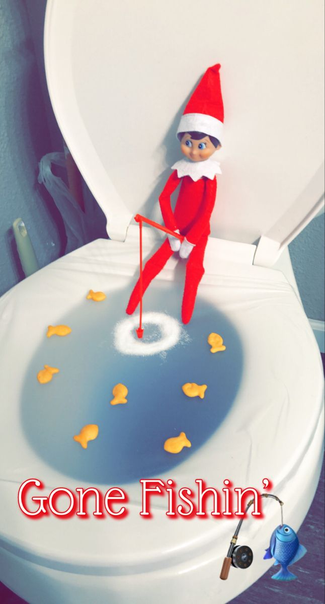 an elf is sitting on top of a toilet with the caption gone fishin '