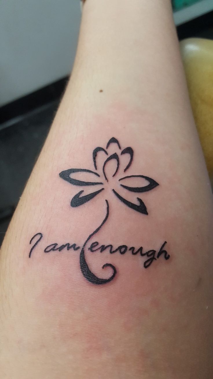 a woman's foot with a tattoo on it that says, pannenough