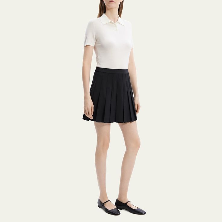 Theory classic knife-pleated skirt in wool suiting Self waistband Mini length A-line silhouette Side seam zipper Wool/elastane Dry clean Imported