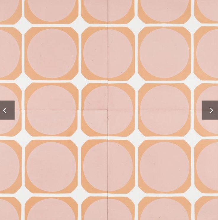 an orange and pink wall with circles on it that have arrows pointing in different directions