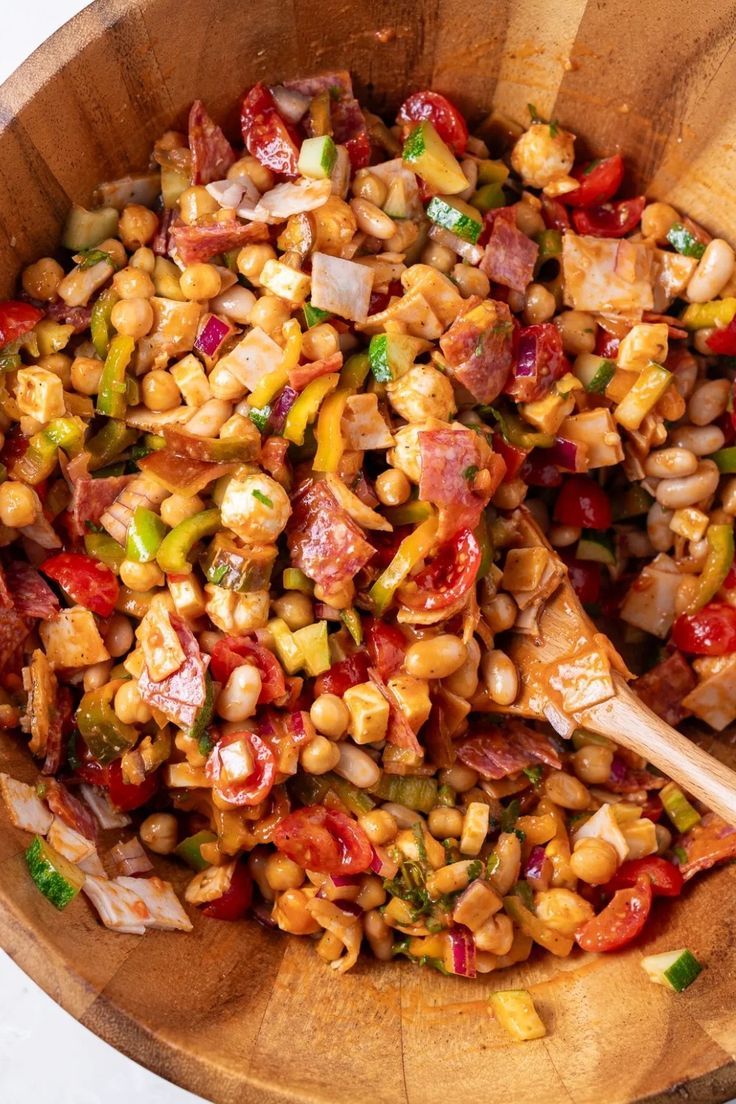 This dense bean salad recipe is packed with high protein, perfect for meal prep. Featuring garbanzo, white beans, cucumber, salami, mozzarella, and with chicken, it's a hearty salad with beans without any lettuce! Toss in a homemade dressing for a flavorful protein simple meal or side dish for gatherings. Ideal if you need sides to bring to a party. Salad With Beans, Garbanzo Beans Salad, Tomato Vinaigrette, High Protein Salads, Bean Salads, Bean Salad Recipe, Bean Salad Recipes, Savory Salads, Hearty Salads