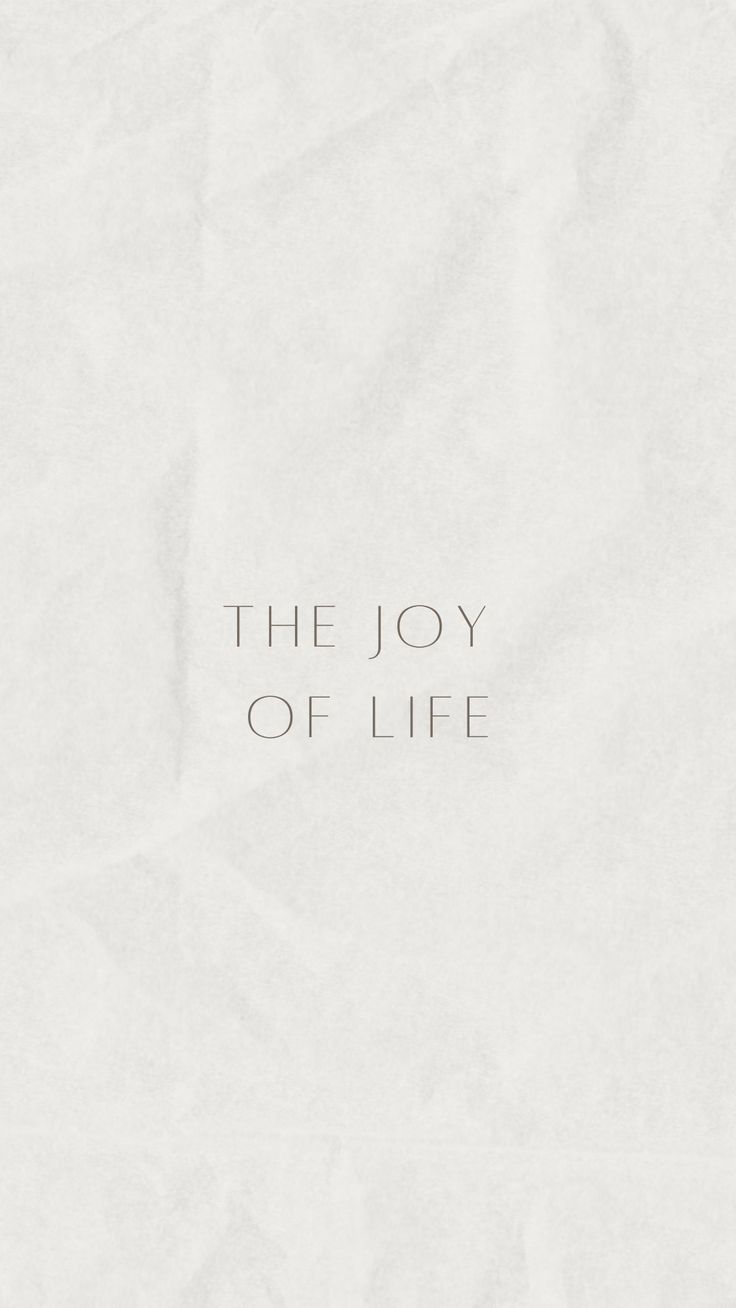 the joy of life written on white paper