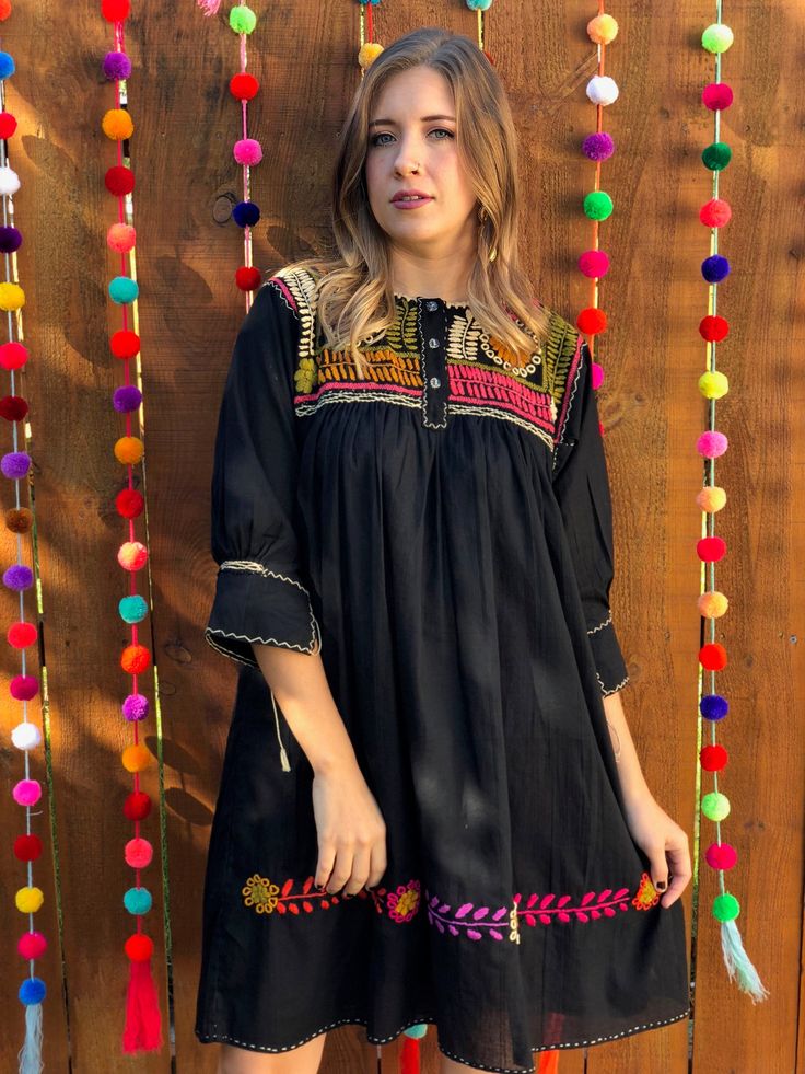 This gorgeous Embroidered dress is traditional yet modern. It is one of a kind! Traditional Black Tunic Dress, Summer Festive Dress With Geometric Embroidery, Geometric Embroidery Dresses For Festivals, Festive Dress With Geometric Embroidery For Festivals, Festive Dresses With Geometric Embroidery, Festival Dresses With Geometric Embroidery, Fitted Bohemian Embroidered Dress For Festive Occasions, Festive Dresses With Embroidered Sleeves, Festive Dresses With Embroidered Sleeves For Festivals