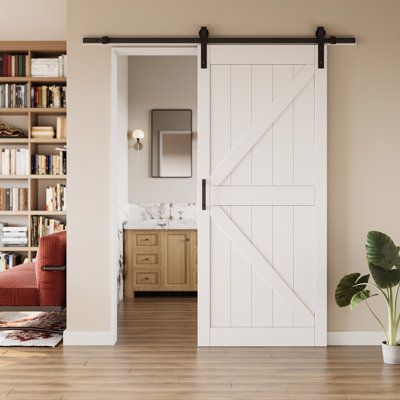 a living room with a sliding barn door