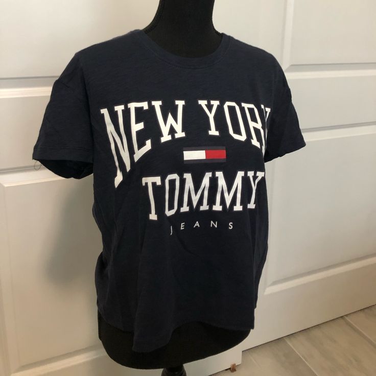 Bought This Cute T Shirt From Pacsun But Just Never Reached For It. It’s Semi Cropped And Fits Loosely For A Small. The Logo And Design On Front Is Printed Very Well And It’s New With Tags! Never Worn! It’s Such A Cute Look For A Lunch Date Or Even Just Lounging At Home. Tommy Hilfiger Letter Print Tops For Spring, Tommy Hilfiger Crew Neck Top For Summer, Tommy Hilfiger Tops With Letter Print For Summer, Tommy Hilfiger Tops With Logo Print For Spring, Tommy Hilfiger Casual Crew Neck Tops, Tommy Hilfiger Summer Crew Neck Top, Trendy Tommy Hilfiger Crew Neck Top, Trendy Tommy Hilfiger Tops With Graphic Print, Trendy Tommy Hilfiger Cotton Tops