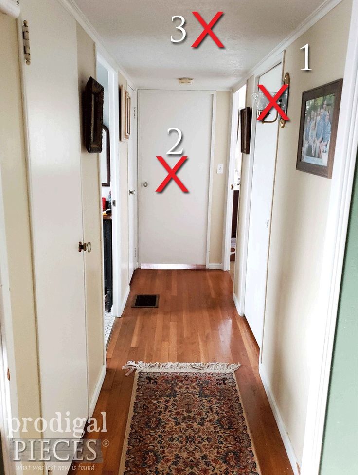 an image of a hallway that has two numbers on the wall and one number in the floor