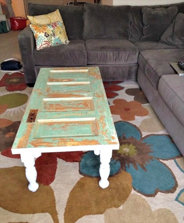 a living room with couches and a coffee table in the middle on a rug