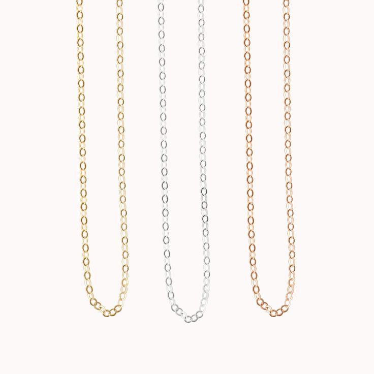 This minimalist, dainty chain is a must-have for every jewelry lover and the perfect base for layering other designs. It is also a great, simple chain if you're looking for something to string a small pendant on! Handcrafted in our Salt Lake City studio ✨ Minimalist Chain Link Necklace For Gift, Dainty 14k Gold Chain Charm Necklace, Simple Everyday Cable Chain Necklace, Minimalist Oval Link Charm Necklace As Gift, Minimalist Necklace With Cable Chain And Oval Link, Classic Rose Gold Charm Necklace With Delicate Chain, Everyday Rose Gold Charm Necklace With Delicate Chain, Classic Charm Necklace With Delicate Chain For Everyday, Minimalist Delicate Chain Necklace