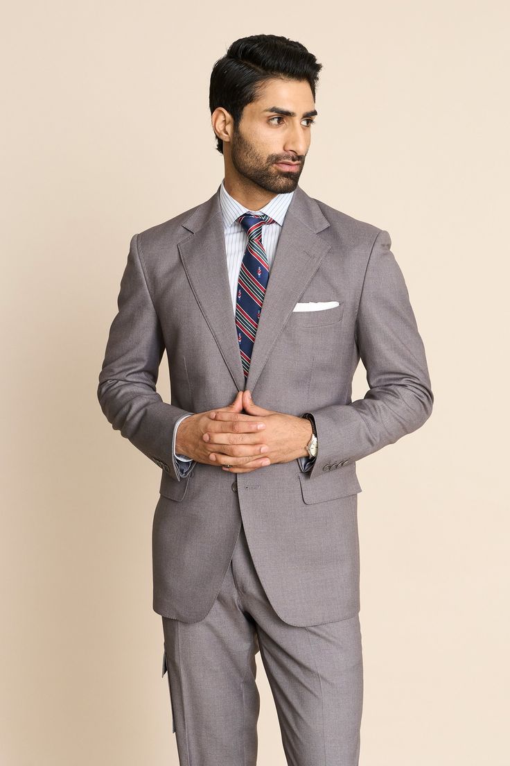 Grey lined blazer with one welt pocket, two flap pockets in front and notch lapel collar. Comes with co-ordinating pant.
Components: 2
Neckline: Notch Lapel
Sleeve Type: Long
Fabric: Super 110's Poly Viscose
Color: Grey
Other Details: 
Welt and flap pockets in front
Closure: Button front
Note: The inner shirt, pocket square and tie worn by the model is not for sale
Occasion: Cocktail and Reception - Aza Fashions Shirt Pocket, Lapel Blazer, Pant Set, Lapel Collar, Pocket Square, Aza Fashion, Flap Pocket, Sleeve Type, Welt Pocket