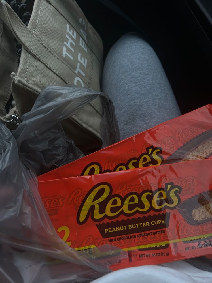 there is a bag of reese's peanut butter cups in the back of a car