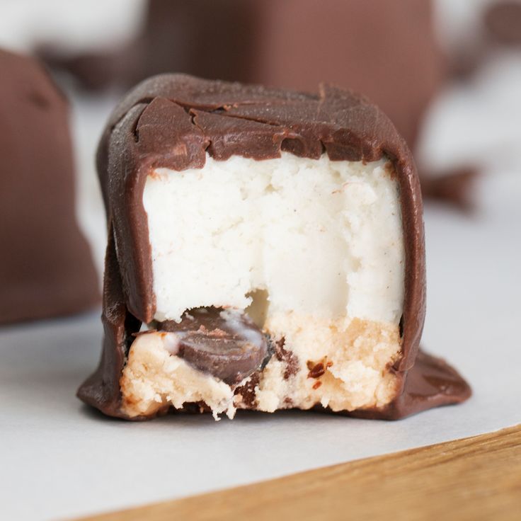 an ice cream filled with chocolate on top of a table