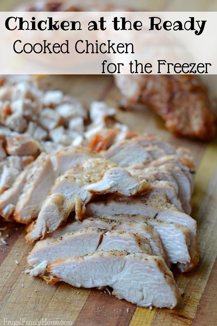 sliced chicken on a wooden cutting board with text overlay that reads chicken at the ready cooked chicken for the freezer