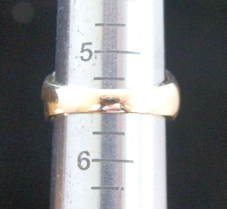 a close up of a measuring tape with a ring on it