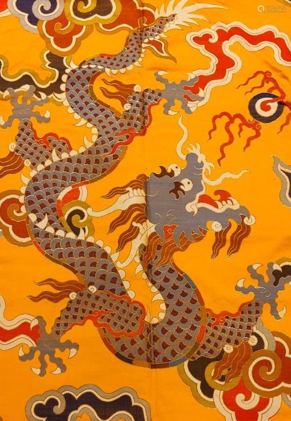 an orange background with dragon designs on it