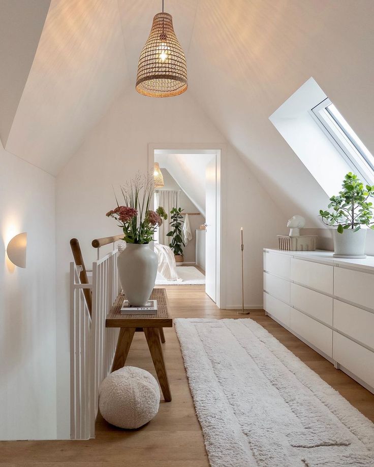 a room with white walls and wooden floors