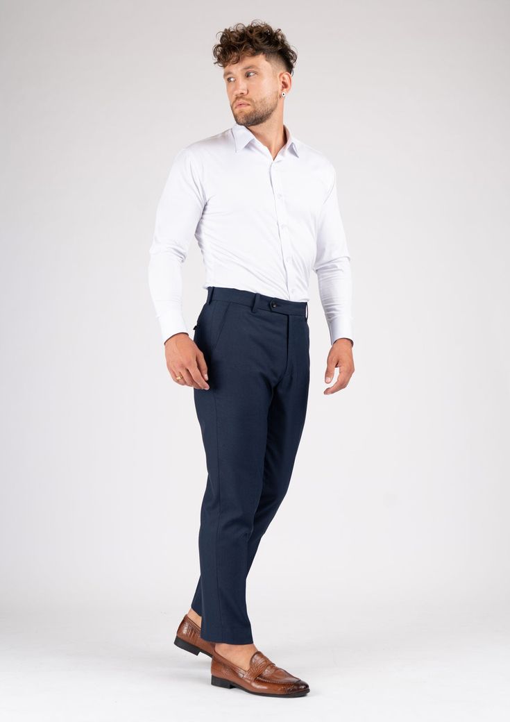 The Navy Sharkskin pants are the perfect choice for any smart occasion. Crafted with a luxurious navy sharkskin fabric and custom made for a premium appearance, they have a deep blue color, a stylish and modern cut, and will make you look and feel confident. Navy Business Casual Pants With Straight Hem, Elegant Navy Bottoms For Business Casual, Navy Slim Fit Pants For Business Casual, Elegant Navy Bottoms For Semi-formal Occasions, Navy Straight Hem Pants For Business Casual, Navy Business Casual Bottoms With Straight Hem, Navy Bottoms For Business Casual With Straight Hem, Elegant Navy Tapered Leg Dress Pants, Navy Elegant Tapered Leg Dress Pants