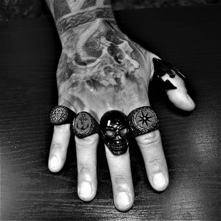 Introducing our Black Heavy Grin Skull Ring, a bold and striking piece of jewelry crafted from high-quality stainless steel. This stunning ring features a highly detailed and intricately designed skull motif, perfect for those who love edgy and alternative fashion. Our Grin Skull Ring is the ideal accessory for anyone looking to make a statement with their style. With its durable construction and high-quality materials, this ring is built to last, ensuring that you can wear it for years to come. Punk Style Black Skull Ring Gift, Symbolic Black Metal Skull Ring, Black Metal Skull Ring Symbolic Style, Black Punk Metal Rings, Black Metal Punk Rings, Black Metal Skull Ring As Gift, Black Metal Skull Ring Gift, Punk Style Black Metal Rings, Black Metal Skull Ring For Gift