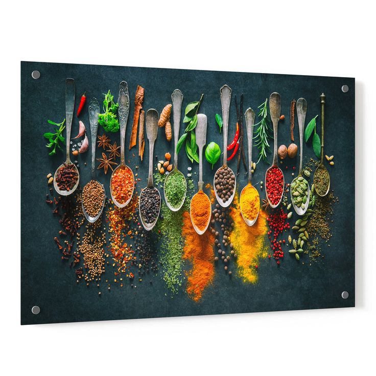 a group of spoons filled with different types of spices and seasoning on top of each other