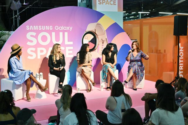 four women sitting on stools in front of a stage with the words soul space