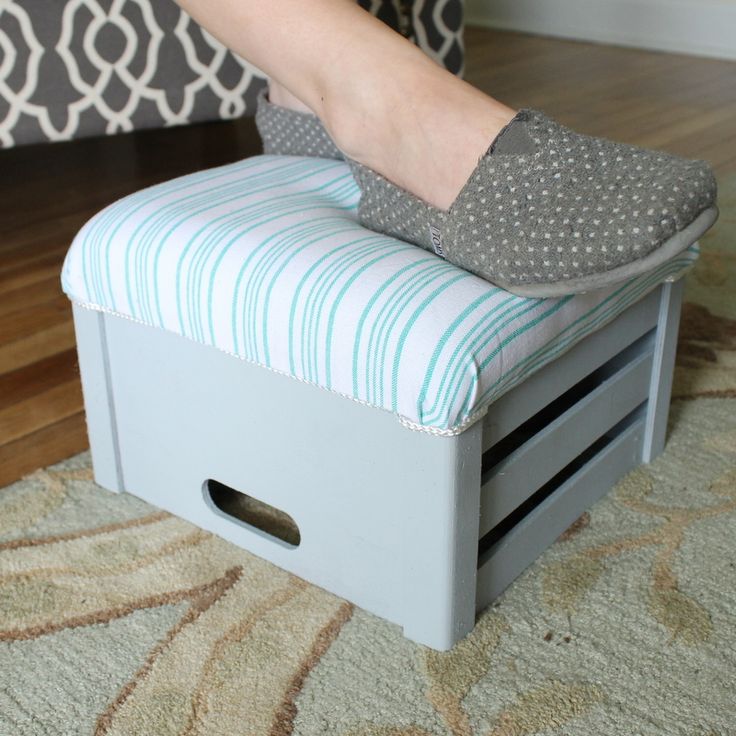 a person standing on top of a step stool with their foot resting on the cushion