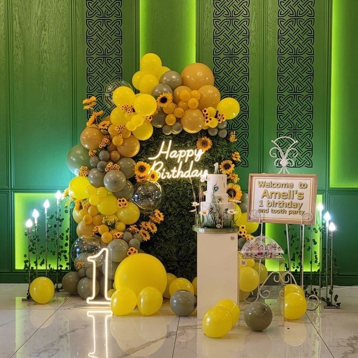 a birthday party with sunflowers and balloons