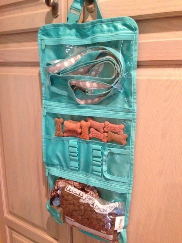 an image of a purse hanging on the wall with food in it and other items inside